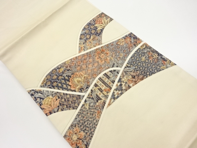 切り嵌め手描き花唐草に古典柄・抽象模様名古屋帯